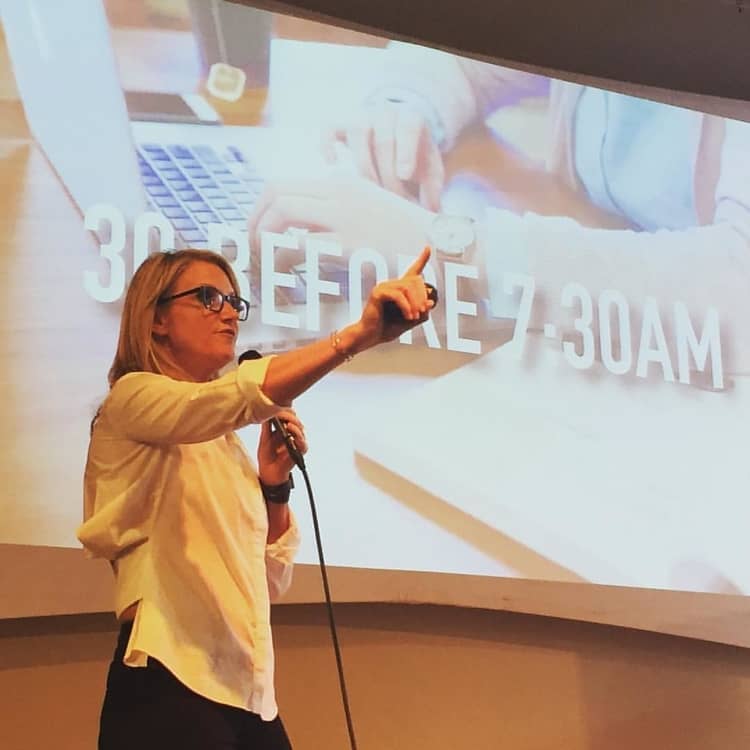 Motivational speaker Mel Robbins giving a talk.