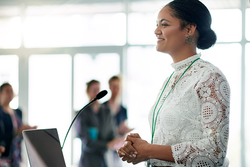 Shot of a young woman delivering a presentation with confidence