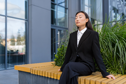 a woman performing breathing exercises before speech
