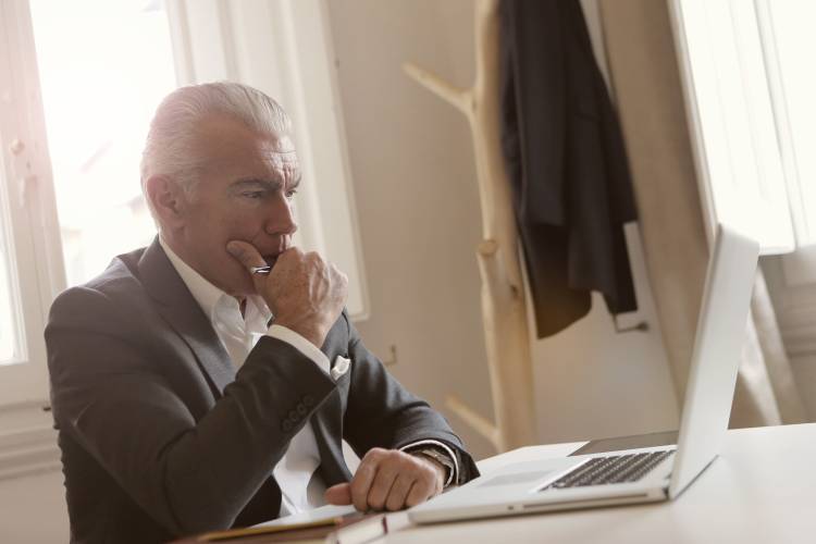 Man looking at his laptop screen